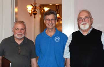 Photo of John Staicer, president of Historic Madison and Rushlight Club members that assisted in Shrewsbury-Windel lighting restoration.